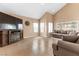 Cozy living room with a fireplace, tile floors, and an inviting atmosphere at 94 Fantasia Ln, Henderson, NV 89074