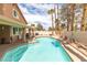 Sparkling pool and spa with mature landscaping create a private backyard retreat at 94 Fantasia Ln, Henderson, NV 89074