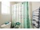Bathroom shower with decorative curtain and window offering natural light at 10126 Cliff Dwellings Ave, Las Vegas, NV 89178