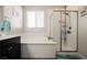 Bright bathroom featuring a soaking tub and walk-in shower with glass door at 10126 Cliff Dwellings Ave, Las Vegas, NV 89178