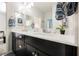Bathroom features double sinks, modern vanity, and decorative accents at 10126 Cliff Dwellings Ave, Las Vegas, NV 89178