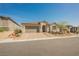 Charming single-story home with desert landscaping and a brick paved driveway at 10126 Cliff Dwellings Ave, Las Vegas, NV 89178