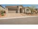 Charming single-story home with a tiled roof, neat landscaping, and a two-car garage at 10126 Cliff Dwellings Ave, Las Vegas, NV 89178