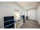 Bright foyer with wood-look flooring and stylish storage console with barn doors at 10126 Cliff Dwellings Ave, Las Vegas, NV 89178