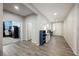Inviting foyer with wood-look tile flooring and neutral walls, leading to a home office at 10126 Cliff Dwellings Ave, Las Vegas, NV 89178