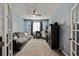 Comfortable home office with a ceiling fan, a sofa, and natural light at 10126 Cliff Dwellings Ave, Las Vegas, NV 89178