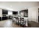 Modern kitchen with dark cabinetry, stainless steel appliances, and a large center island at 10126 Cliff Dwellings Ave, Las Vegas, NV 89178