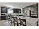 Contemporary kitchen with stainless steel appliances and a large island with seating at 10126 Cliff Dwellings Ave, Las Vegas, NV 89178