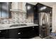 Modern kitchen featuring stainless steel appliances, a gas cooktop, and stylish backsplash at 10126 Cliff Dwellings Ave, Las Vegas, NV 89178