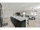 Open layout with kitchen island that opens up to the living and dining area at 10126 Cliff Dwellings Ave, Las Vegas, NV 89178