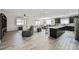 Open-concept living space featuring modern flooring and plenty of natural light at 10126 Cliff Dwellings Ave, Las Vegas, NV 89178