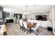 Open-concept living space with kitchen, dining area, and living room featuring modern finishes at 10126 Cliff Dwellings Ave, Las Vegas, NV 89178