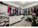Spacious walk-in closet with custom shelving and ample hanging space for clothes and accessories at 10126 Cliff Dwellings Ave, Las Vegas, NV 89178