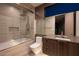 Modern bathroom featuring a sleek vanity, soaking tub with shower, and contemporary fixtures and finishes at 12 Chisel Crest Ct, Henderson, NV 89012
