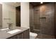 Sleek, modern bathroom featuring a luxurious shower and contemporary vanity with designer fixtures at 12 Chisel Crest Ct, Henderson, NV 89012