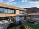 Multi-level home with water feature, manicured lawn, and expansive glass windows for natural light at 12 Chisel Crest Ct, Henderson, NV 89012
