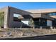 Modern home with xeriscaping and a unique architectural design at 12 Chisel Crest Ct, Henderson, NV 89012