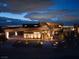 Striking modern home showcases architectural design, complete with a well-lit walkway and manicured landscaping at 12 Chisel Crest Ct, Henderson, NV 89012