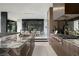 Spacious gourmet kitchen featuring premium appliances, sleek cabinetry, and an adjacent dining area for seamless entertaining at 12 Chisel Crest Ct, Henderson, NV 89012