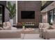 This living room features a modern fireplace, comfortable seating, and a large TV for entertainment at 12 Chisel Crest Ct, Henderson, NV 89012