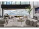 Bright living room boasts expansive windows, neutral tones, and comfortable seating area to capture city views at 12 Chisel Crest Ct, Henderson, NV 89012