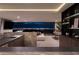 Elegant entertaining area with upscale wet bar, city views, comfortable seating, and game room with billiard table at 12 Chisel Crest Ct, Henderson, NV 89012