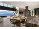 Open concept living space with modern decor, stunning views, and seamless indoor-outdoor flow to entertain guests at 12 Chisel Crest Ct, Henderson, NV 89012