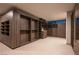 Expansive walk-in closet showcasing custom wood shelving and drawer systems for storage solutions at 12 Chisel Crest Ct, Henderson, NV 89012