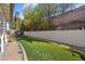 Lush backyard with artificial grass, decorative rock, and a seating area at 1619 Abby Ave, Henderson, NV 89014