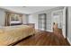 Well-lit bedroom with hardwood floors and a cozy bed at 1619 Abby Ave, Henderson, NV 89014