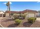 Charming single-story home featuring a tile roof, a well-manicured lawn and a spacious two-car garage at 1619 Abby Ave, Henderson, NV 89014