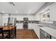 Spacious kitchen featuring stainless steel appliances, white cabinets and a gray backsplash at 1619 Abby Ave, Henderson, NV 89014