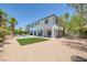 View of the backyard features a pool, lawn, landscaping, and the home's exterior at 2209 Purple Majesty Ct, Las Vegas, NV 89117