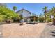 Backyard features a paver patio, seating, desert landscaping, and access to the home at 2209 Purple Majesty Ct, Las Vegas, NV 89117