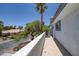 Wide balcony showcasing mature trees and residential architecture, and clear blue skies at 2209 Purple Majesty Ct, Las Vegas, NV 89117