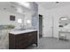 Bathroom featuring single sink vanity, marble surround and a makeup vanity at 2209 Purple Majesty Ct, Las Vegas, NV 89117
