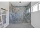 Contemporary bathroom with a glass shower, dual shower heads and marble-style tile at 2209 Purple Majesty Ct, Las Vegas, NV 89117