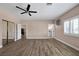 Expansive bedroom with a ceiling fan, natural light and wood-look floors at 2209 Purple Majesty Ct, Las Vegas, NV 89117
