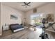 A bedroom with a gym, sliding glass doors, and wood-look flooring at 2209 Purple Majesty Ct, Las Vegas, NV 89117