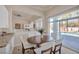 Inviting dining area with sliding glass doors leading to the outdoor pool at 2209 Purple Majesty Ct, Las Vegas, NV 89117