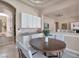 A charming dining area with a wooden table, white chairs, and lovely decor at 2209 Purple Majesty Ct, Las Vegas, NV 89117