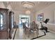 Formal dining room with chandelier, elegant hutch, and large dining table at 2209 Purple Majesty Ct, Las Vegas, NV 89117