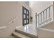 View of the home's foyer featuring marble floors, a double door entry and a staircase at 2209 Purple Majesty Ct, Las Vegas, NV 89117