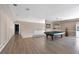 Spacious game room featuring a pool table, wood floors, and neutral walls at 2209 Purple Majesty Ct, Las Vegas, NV 89117