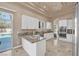 Bright kitchen featuring granite countertops, stainless steel appliances, and poolside access at 2209 Purple Majesty Ct, Las Vegas, NV 89117
