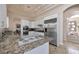 This spacious kitchen features an island cooktop and stainless steel appliances at 2209 Purple Majesty Ct, Las Vegas, NV 89117