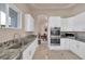 Clean kitchen featuring granite countertops, stainless appliances and ample cabinets at 2209 Purple Majesty Ct, Las Vegas, NV 89117