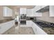 Bright kitchen features white cabinets, granite countertops, and stainless steel appliances at 2209 Purple Majesty Ct, Las Vegas, NV 89117