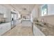 Bright kitchen with white cabinetry, stainless appliances, and granite counters at 2209 Purple Majesty Ct, Las Vegas, NV 89117