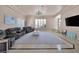 Bright, expansive living room with plush seating and elegant chandelier at 2209 Purple Majesty Ct, Las Vegas, NV 89117